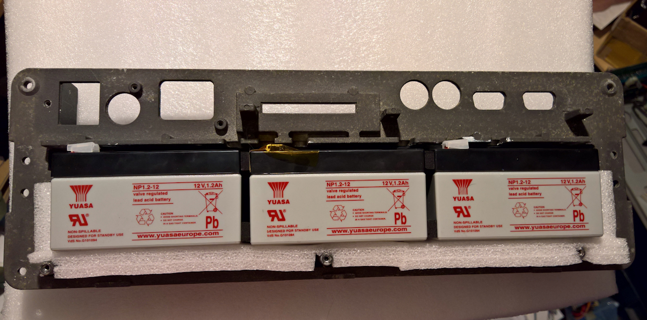 Sticky tape, foam pads (and some extra electrical insulation).. and I've got the feeling that Commodore may have once thought of this!